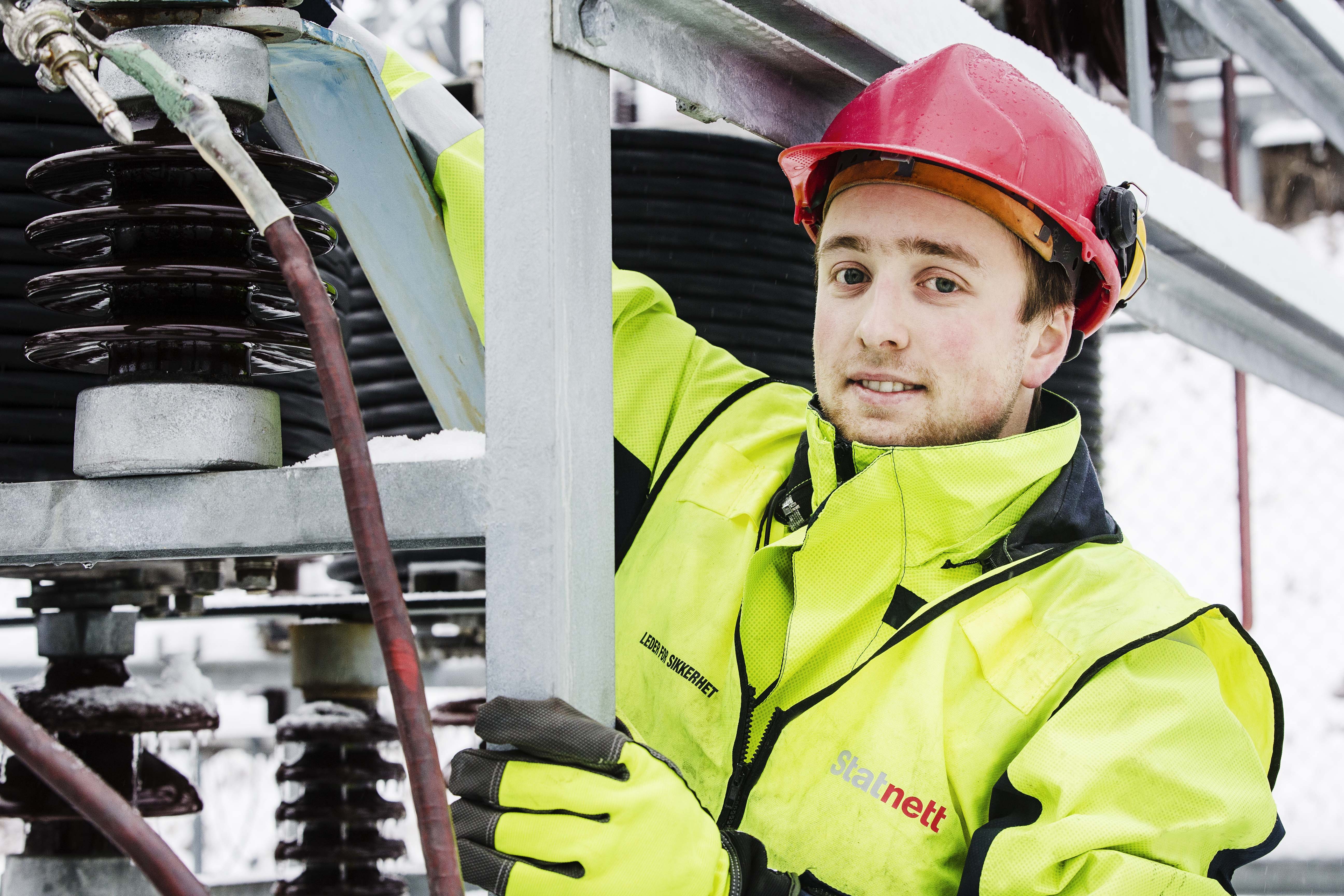 Man working on a substation. Photo.